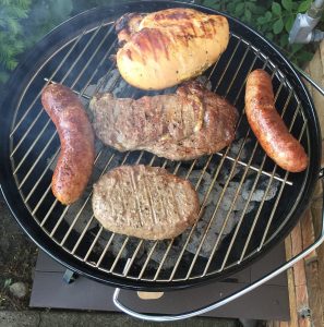 Several options on a small kettle style table top grill.