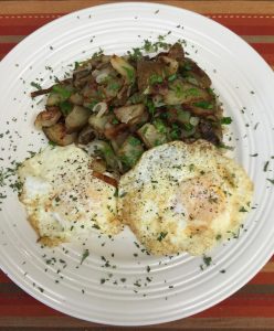 Two over medium eggs, Fried Potatoes with shallot and parsley