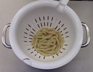 Strain pasta then place the strainer back over the warm pan.  Cover with a lid to keep warm